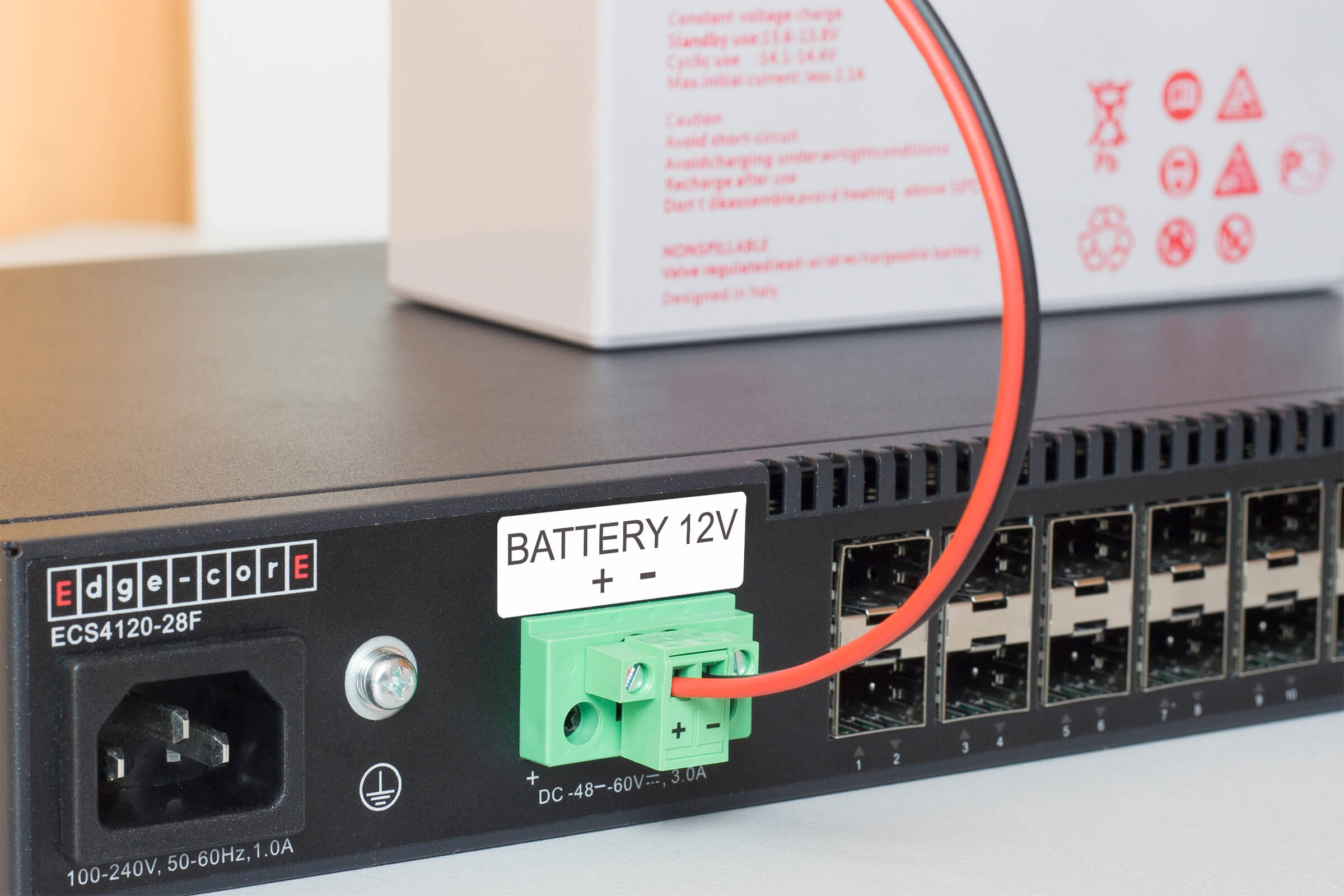 Edge-Core ECS4120-28F - the green connector of the front panel is used to connect the 12V battery